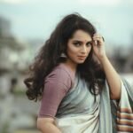 Portrait of a woman in a colorful saree, outdoors in Bangladesh, showcasing traditional fashion and elegance.